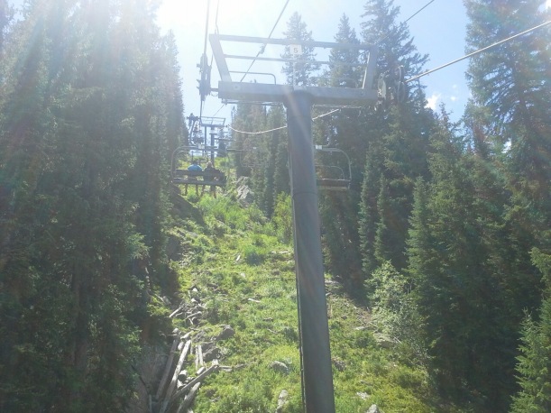 Riding up the Zephyr Express chairlift to the top of the peak. 